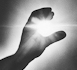 hand grasping sun, logo of New Technology Publishing