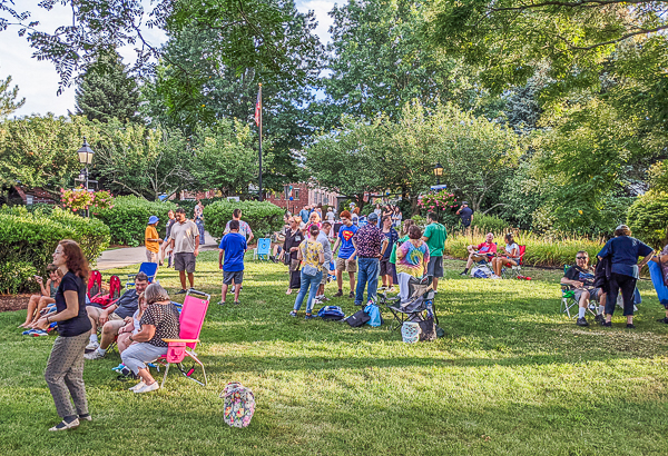 Audience enjoying music in late afternoon scene